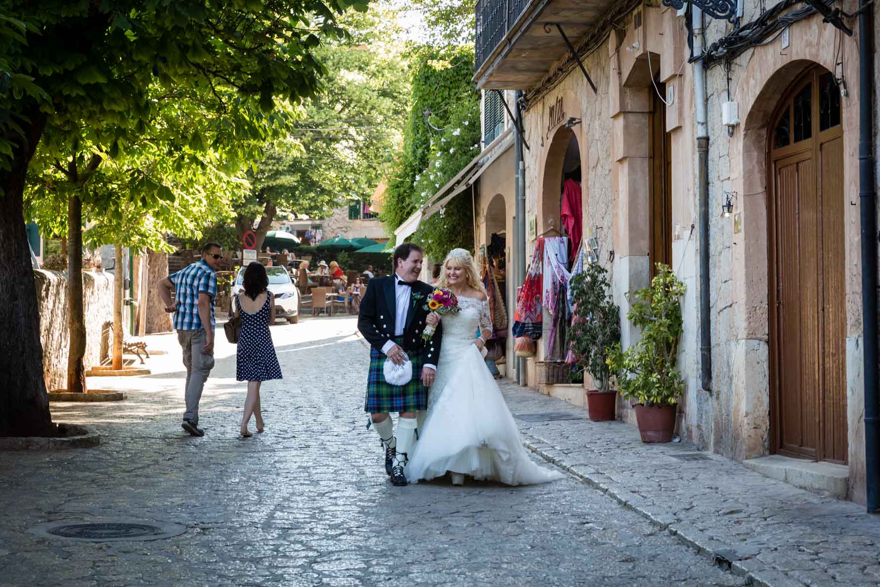 Bride and groom having fun in the Valldemossa streets