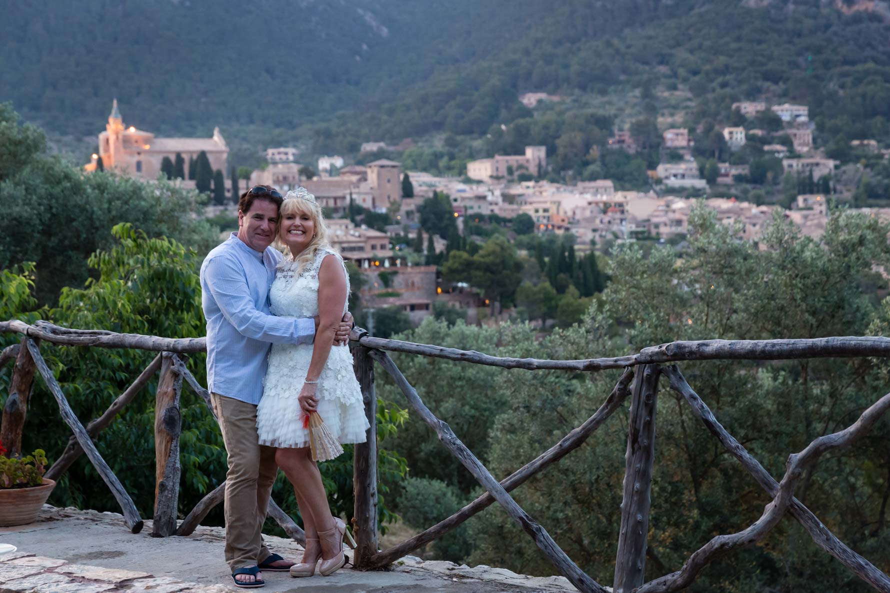 Happy couple at the end of their Mallorca wedding day overlooking Valldemossa wedding
