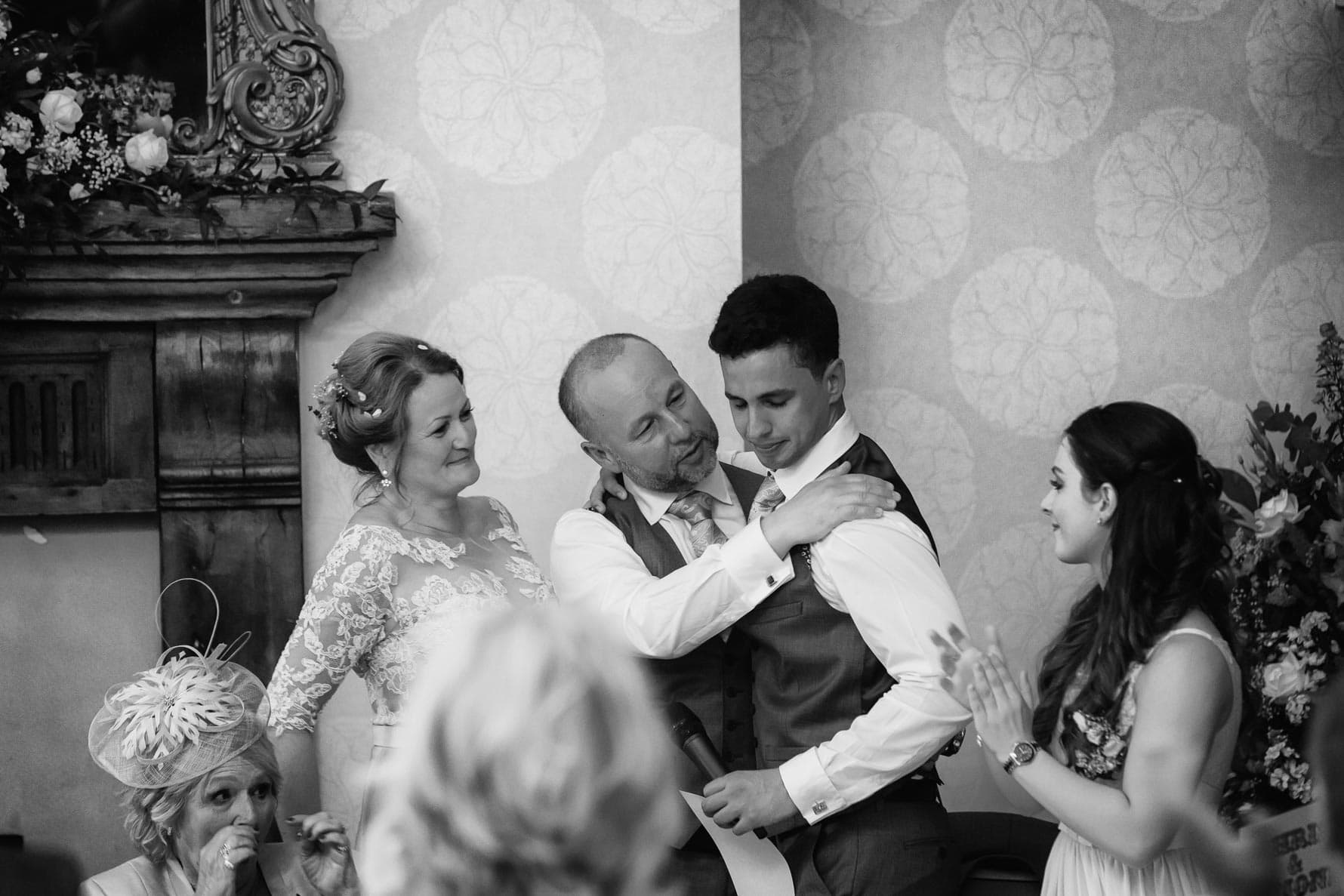 The groom is proud of his best man at Hanbury Manor wedding by Hertfordshire wedding photographer Graham Warrellow