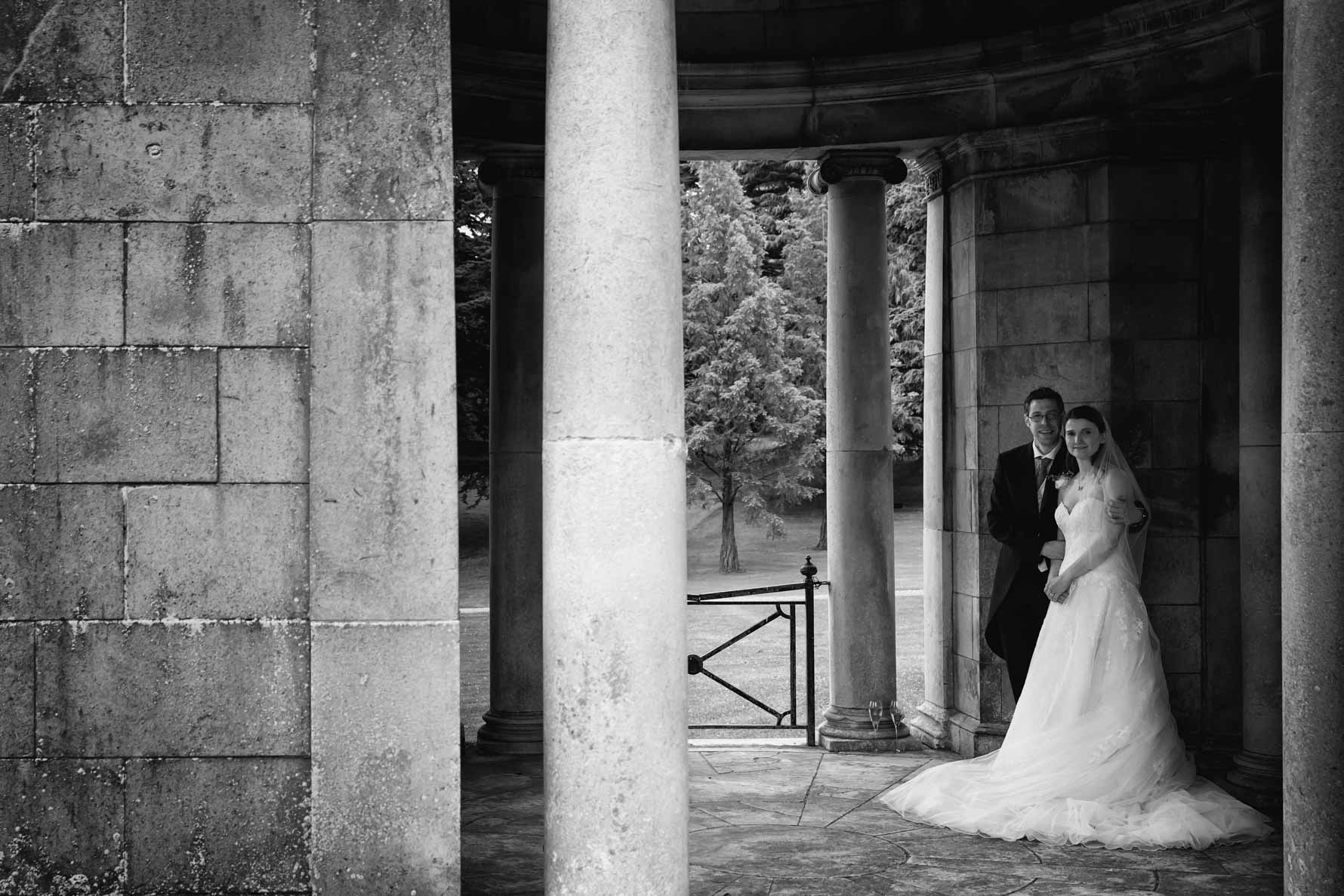 Bride and groom in grounds of Luton Hoo Hotel by Hertfordshire wedding photographer Graham Warrellow