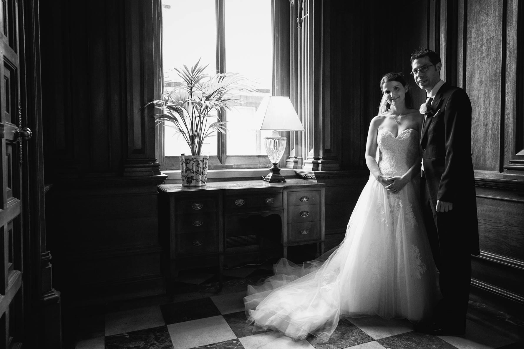 Bride and groom in the hall at Luton Hoo by Bedfordshire wedding photographer Graham Warrellow
