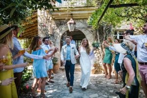 Cathy and Ben on confetti walk during their beautiful Mallorca finca wedding