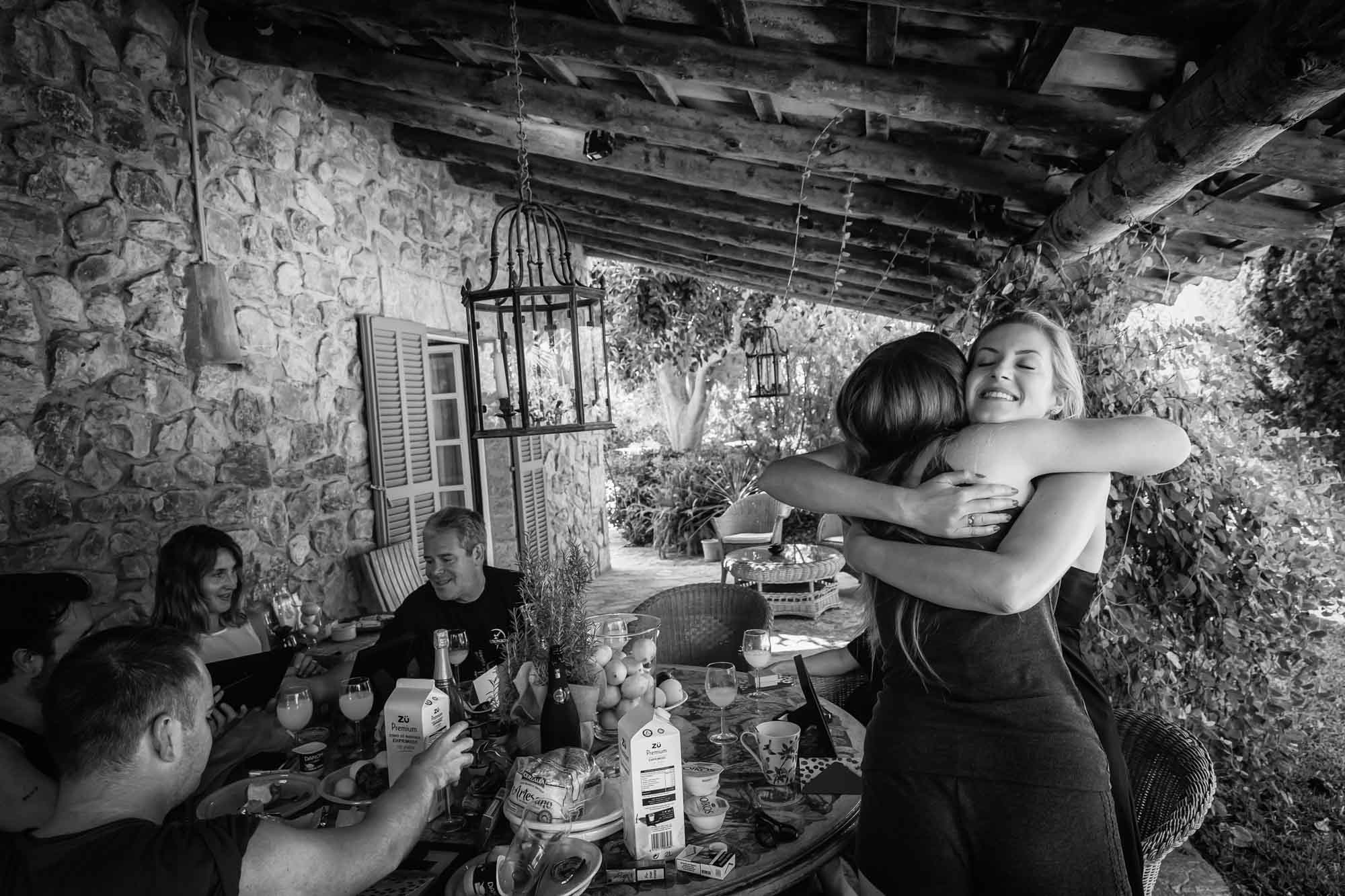 Cathy gives one of her bridesmaids a big hug before her Mallorca finca wedding