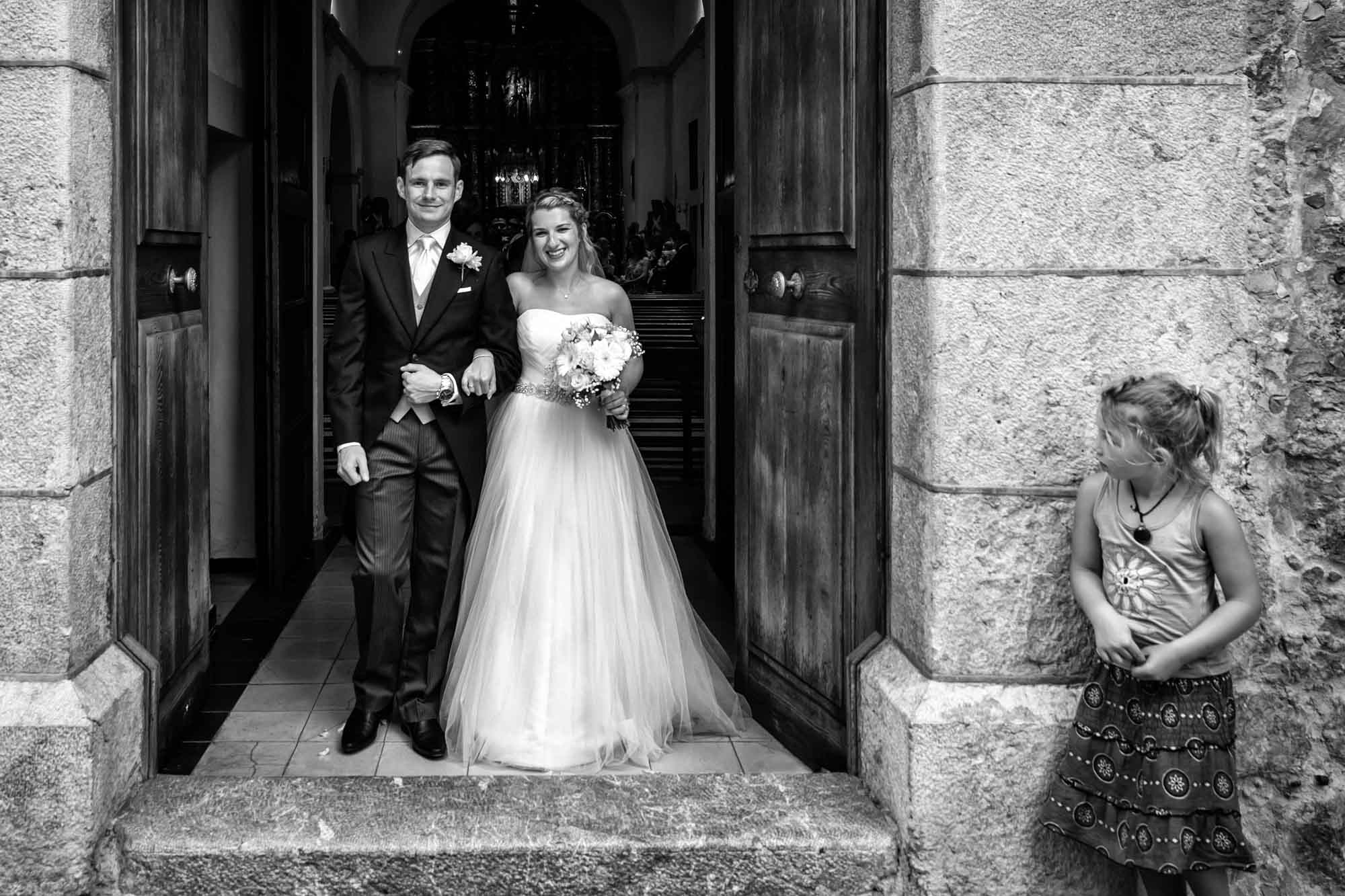 Bride and groom exiting Fornalutx church after their Mallorca wedding