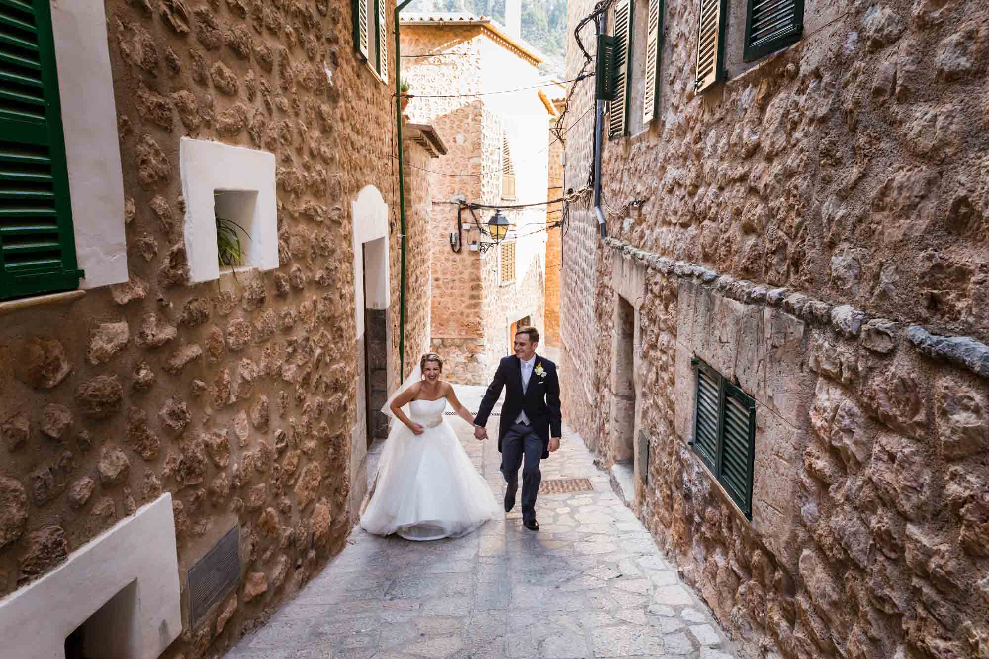 Bride and groom return to Can Vedera by Mallorca wedding photographer Graham Warrellow