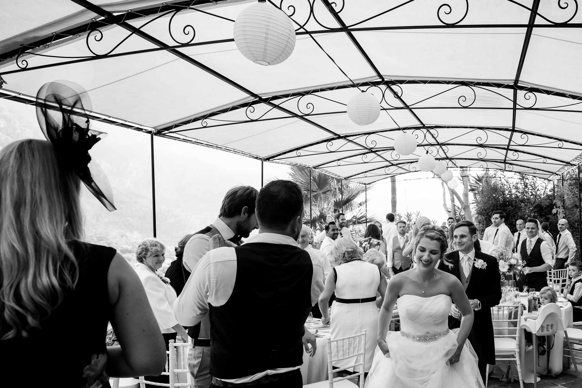 The bride and groom enter the terrace at the beautiful boutique hotel Can Vedera in Fornalutx, Mallorca