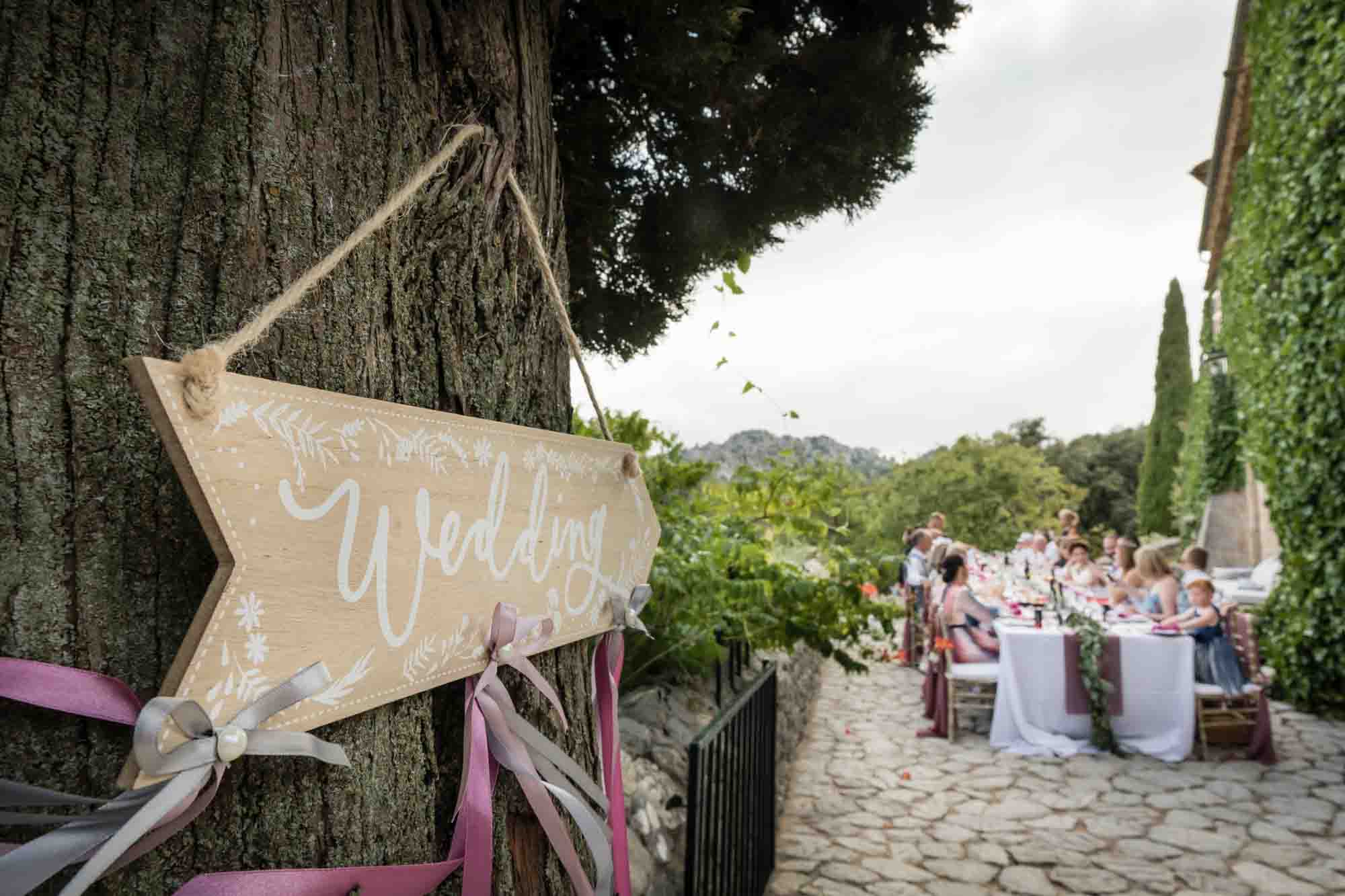 Guests enjoy a relaxed meal at an outdoor finca wedding