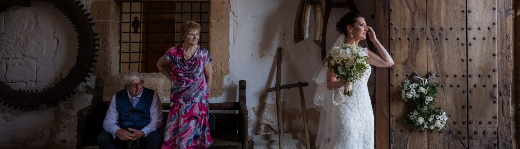 The bride’s grandparents look on proudly as the beautiful bride awaits her guests at Son Termes in Mallorca